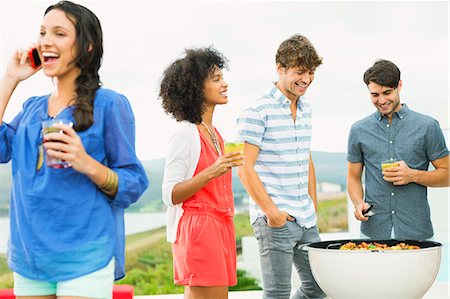 Friends talking at barbecue Stock Photo - Premium Royalty-Free, Code: 6113-07148012