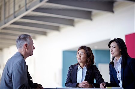 simsearch:6113-07159058,k - Business people talking in meeting Stock Photo - Premium Royalty-Free, Code: 6113-07159058