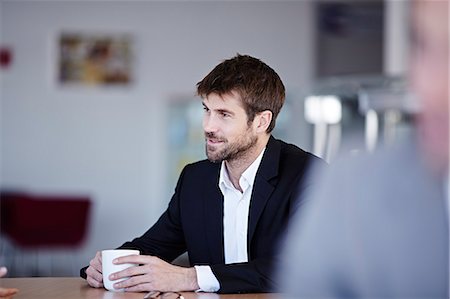 drinking coffe interior - Businessman drinking coffee in cafe Foto de stock - Sin royalties Premium, Código: 6113-07159065