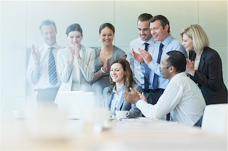 simsearch:6113-07242205,k - Business people cheering in meeting Stock Photo - Premium Royalty-Free, Code: 6113-07159030