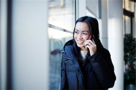 respond - Woman talking on cell phone Stock Photo - Premium Royalty-Free, Code: 6113-07159104