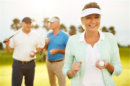 portrait of smiling middle aged man - Senior friends on golf course Stock Photo - Premium Royalty-Free, Code: 6113-07159206