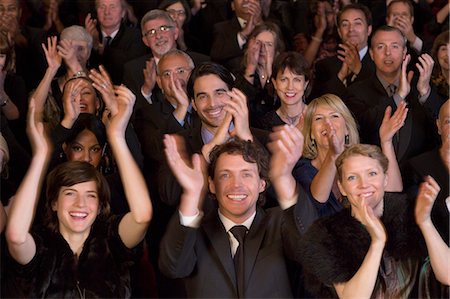 people clapping hands - Happy audience clapping in theater Stock Photo - Premium Royalty-Free, Code: 6113-07159346