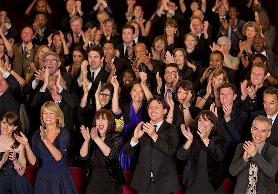 Clapping theater audience Stock Photo - Premium Royalty-Free, Image code: 6113-07159369