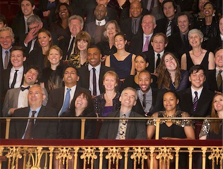 simsearch:6113-07542944,k - Laughing audience in theater balcony Foto de stock - Sin royalties Premium, Código: 6113-07159380