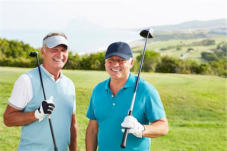 Smiling senior men on golf course Stock Photo - Premium Royalty-Free, Code: 6113-07159320