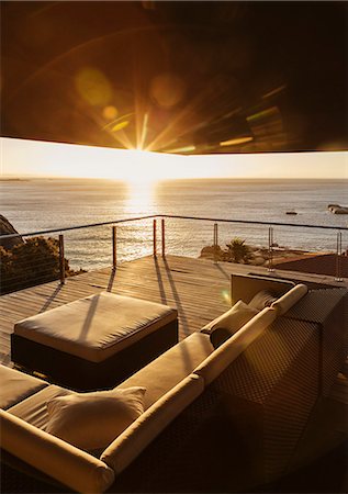 simsearch:6113-07159475,k - View of sunset over ocean from luxury balcony Stock Photo - Premium Royalty-Free, Code: 6113-07159415