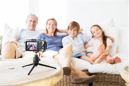 simsearch:6113-07159498,k - Family taking picture of themselves on sofa Stock Photo - Premium Royalty-Free, Code: 6113-07159562