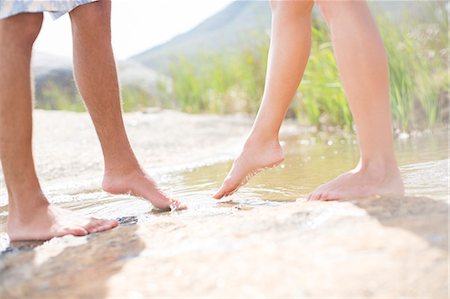 feet couple - Couple dipping feet in rural pond Stock Photo - Premium Royalty-Free, Code: 6113-07159664