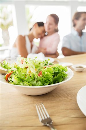 Close up of bowl of salad on table Stock Photo - Premium Royalty-Free, Code: 6113-07159668