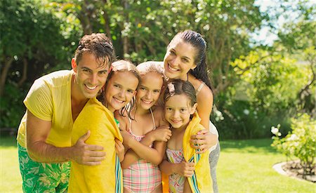 family of five hugging - Family relaxing together in backyard Stock Photo - Premium Royalty-Free, Code: 6113-07159708