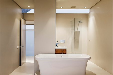simsearch:6113-07160716,k - Bathtub, sink and shower in modern bathroom Foto de stock - Sin royalties Premium, Código: 6113-07159859