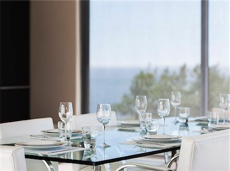 simsearch:6113-07790464,k - Set table in modern dining room Foto de stock - Sin royalties Premium, Código: 6113-07159805