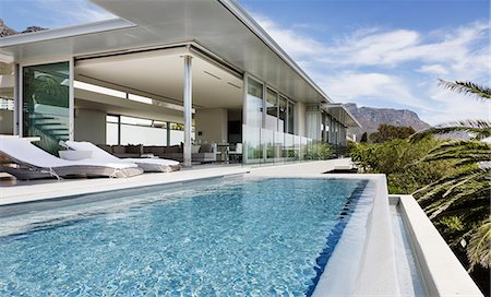 simsearch:6113-07159879,k - Swimming pool and patio of modern house Stock Photo - Premium Royalty-Free, Code: 6113-07159817