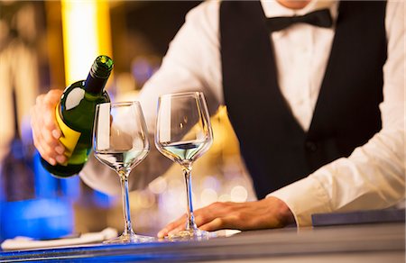 Well dressed bartender pouring wine Stock Photo - Premium Royalty-Free, Code: 6113-07159922