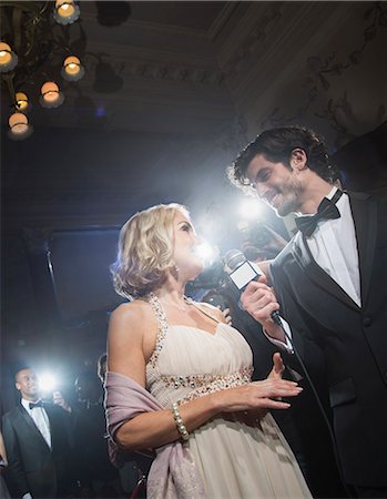 Well dressed female celebrity being interviewed at red carpet event Stock Photo - Premium Royalty-Free, Code: 6113-07160094