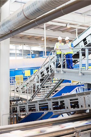 factory meeting - Workers looking at blueprints in recycling center Stock Photo - Premium Royalty-Free, Code: 6113-07160251