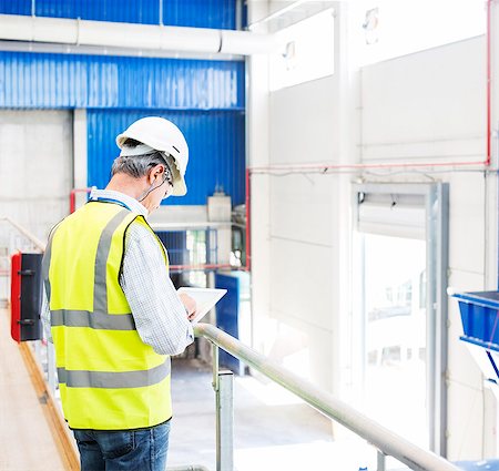 digital tablet industrial - Worker with digital tablet in warehouse Stock Photo - Premium Royalty-Free, Code: 6113-07160265