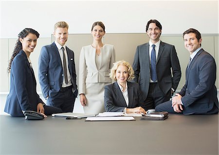 Business people smiling in conference room Stock Photo - Premium Royalty-Free, Code: 6113-07160396