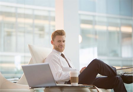 Businessman using laptop in office Stock Photo - Premium Royalty-Free, Code: 6113-07160448