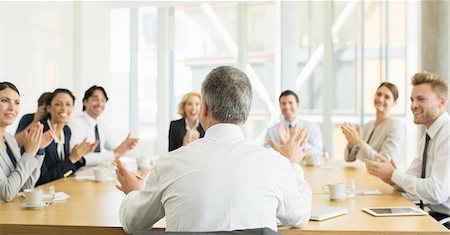 Business people clapping in meeting Stock Photo - Premium Royalty-Free, Code: 6113-07160460