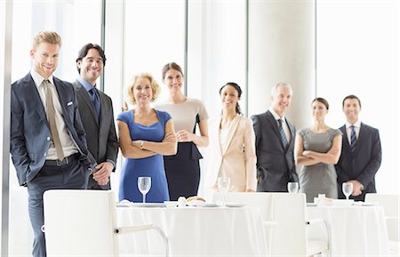 standing in a line - Business people smiling in restaurant Stock Photo - Premium Royalty-Free, Code: 6113-07160479