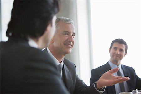 Businessmen talking in meeting Stock Photo - Premium Royalty-Free, Code: 6113-07160499