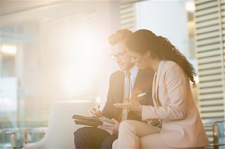 side view of someone sitting in chair - Business people talking in office Stock Photo - Premium Royalty-Free, Code: 6113-07160550