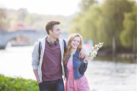 Couple walking along river Stock Photo - Premium Royalty-Free, Code: 6113-07160563