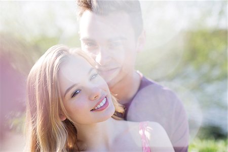 simsearch:6113-07160576,k - Couple hugging outdoors Stock Photo - Premium Royalty-Free, Code: 6113-07160562