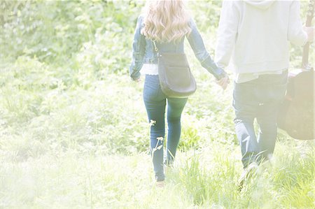 romantic couple holding hands - Couple holding hands in park Stock Photo - Premium Royalty-Free, Code: 6113-07160573