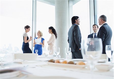 pictures of people standing on a table - Business people talking in restaurant Stock Photo - Premium Royalty-Free, Code: 6113-07160513