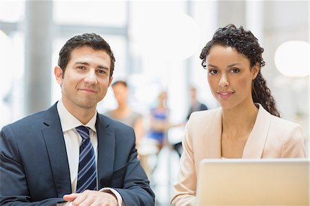 partnership work - Business people smiling in office Stock Photo - Premium Royalty-Free, Code: 6113-07160522