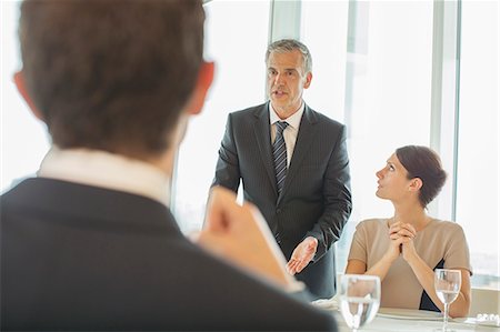 people arguing at restaurant table pictures - Business people talking in meeting Stock Photo - Premium Royalty-Free, Code: 6113-07160536