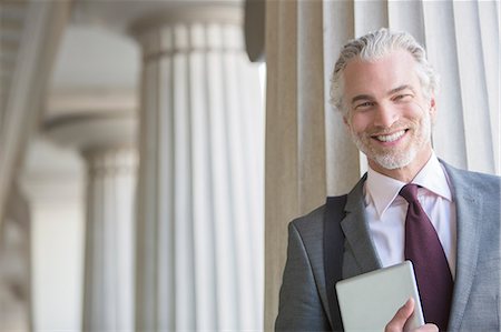 enthusiastic business man - Businessman smiling outdoors Stock Photo - Premium Royalty-Free, Code: 6113-07160692