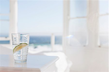 sunlight interior - Glass of water with lime on table Stock Photo - Premium Royalty-Free, Code: 6113-07160832