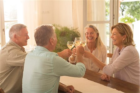 simsearch:6122-07701755,k - Senior couples toasting wine glasses at table Stock Photo - Premium Royalty-Free, Code: 6113-07241969