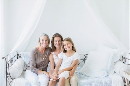 simsearch:6113-07242590,k - Multi-generation women smiling on daybed Foto de stock - Sin royalties Premium, Código: 6113-07242075