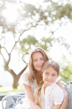 Mother and daughter hugging outdoors Stock Photo - Premium Royalty-Free, Code: 6113-07242078