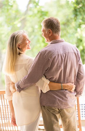 simsearch:6113-06721212,k - Senior couple hugging on patio Stock Photo - Premium Royalty-Free, Code: 6113-07242081