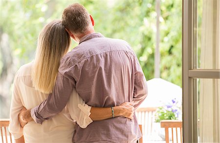 seeing - Senior couple hugging in doorway Stock Photo - Premium Royalty-Free, Code: 6113-07242034