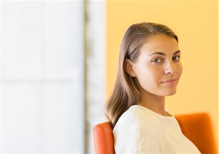 Businesswoman smiling in office Stock Photo - Premium Royalty-Free, Code: 6113-07242191