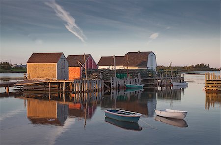 Rowboats and buildings on calm bay Stock Photo - Premium Royalty-Free, Code: 6113-07242264