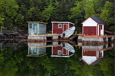 simsearch:6113-07242277,k - Boat and buildings on calm bay Stock Photo - Premium Royalty-Free, Code: 6113-07242276