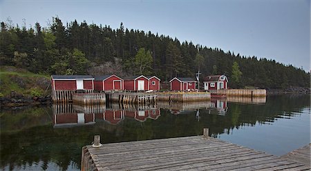 Buildings and docks along calm bay Stock Photo - Premium Royalty-Free, Code: 6113-07242278