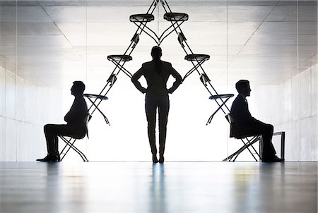 pyramid - Businesswoman examining office chair installation art Stock Photo - Premium Royalty-Free, Code: 6113-07242215