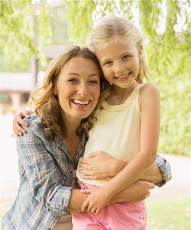 simsearch:6113-06909386,k - Mother and daughter hugging outdoors Stock Photo - Premium Royalty-Free, Code: 6113-07242357