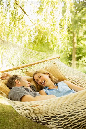 simsearch:632-07674438,k - Couple relaxing in hammock outdoors Stock Photo - Premium Royalty-Free, Code: 6113-07242302