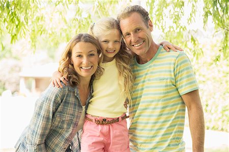 Family smiling together outdoors Stock Photo - Premium Royalty-Free, Code: 6113-07242338
