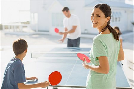 family hispanic father mother children boy girl - Family playing table tennis together outdoors Stock Photo - Premium Royalty-Free, Code: 6113-07242553